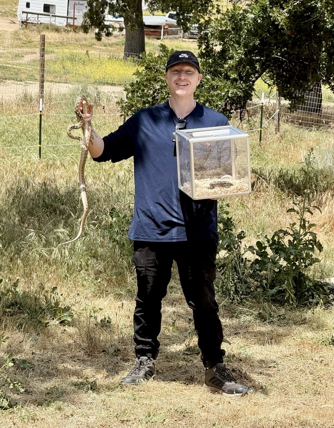 Snake handler Scott with a non-venomous gopher snake and live rattlesnakes during Snake School training