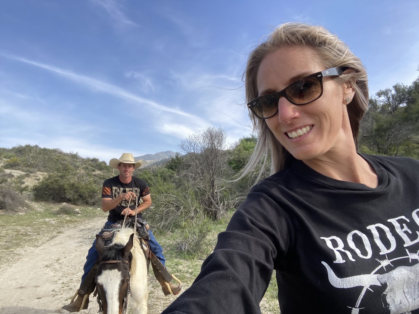 Shane and his wife on horseback at the ranch