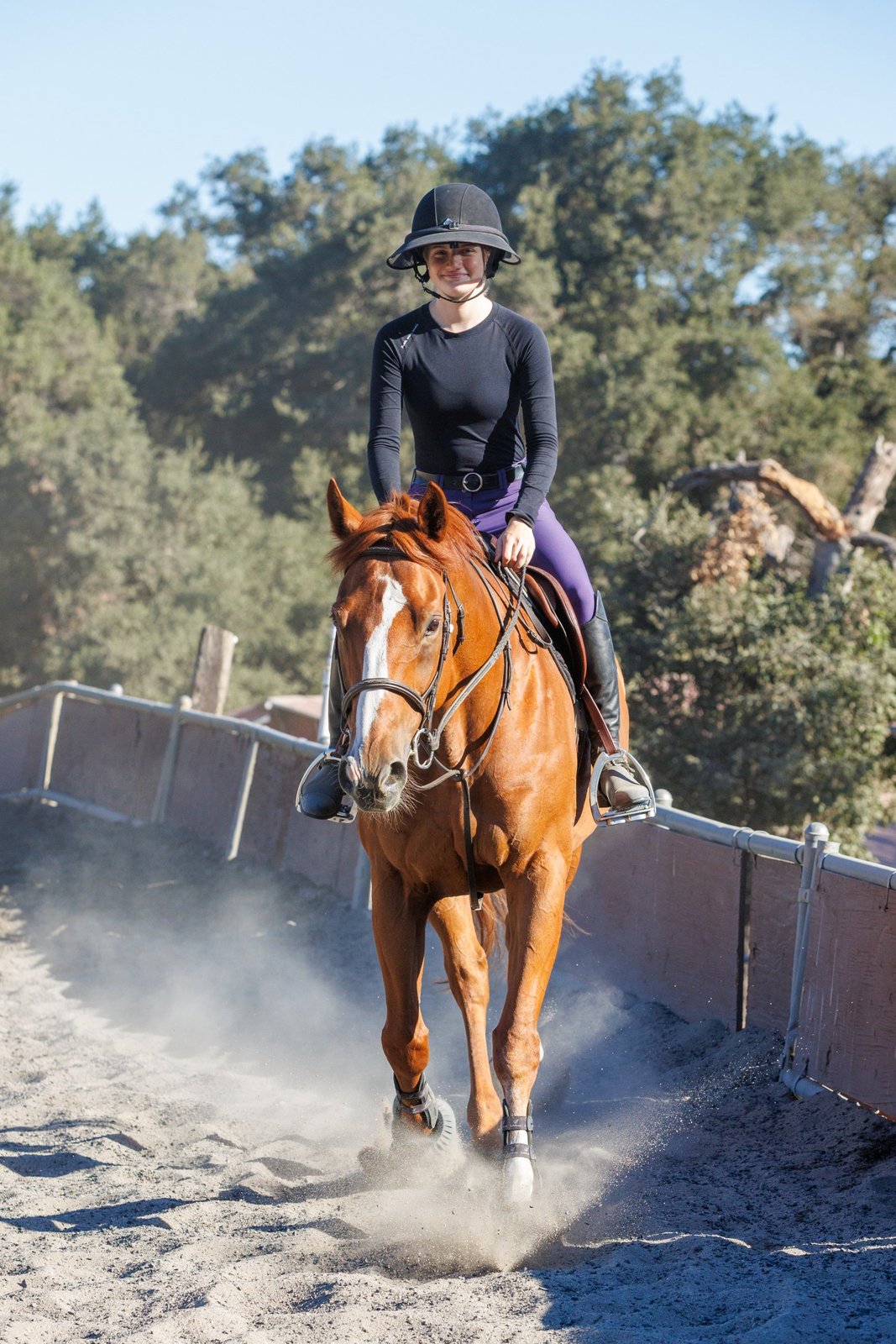 Helena S., Snake School rattlesnake handler and dog trainer, riding a horse